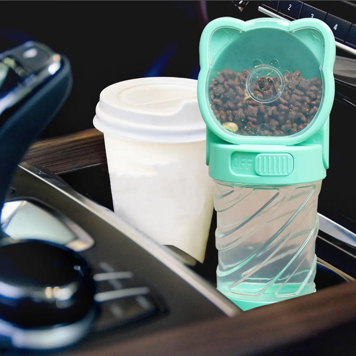 Green, pink, and white 3-in-1 portable pet water bottle with food container and bag dispenser