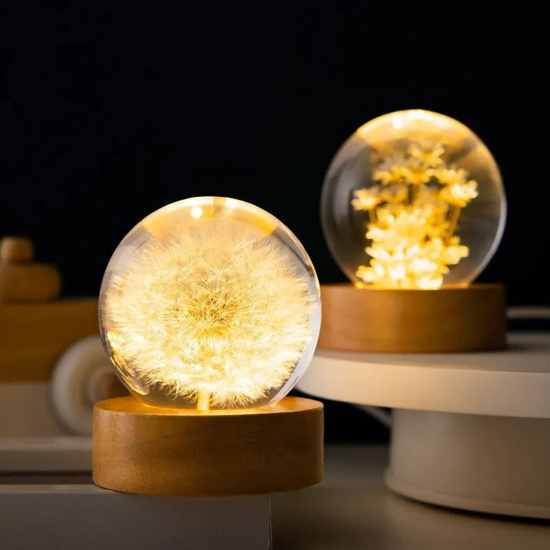 Luminous 3D dandelion in crystal ball on beech wood stand, USB-powered desktop night light.
