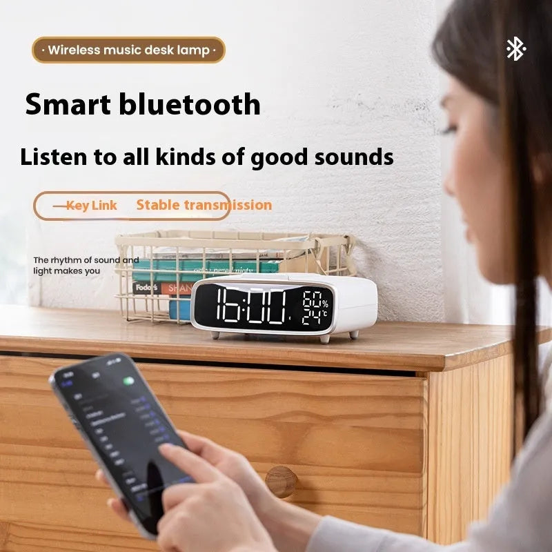 White wireless charger with Bluetooth speaker and night lamp functions showing Qi charging surface