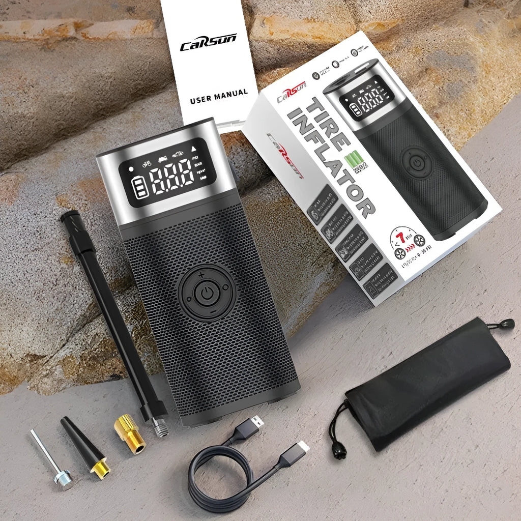 Black portable wireless vehicle air pump with USB-C cable and multiple inflation nozzles in storage bag