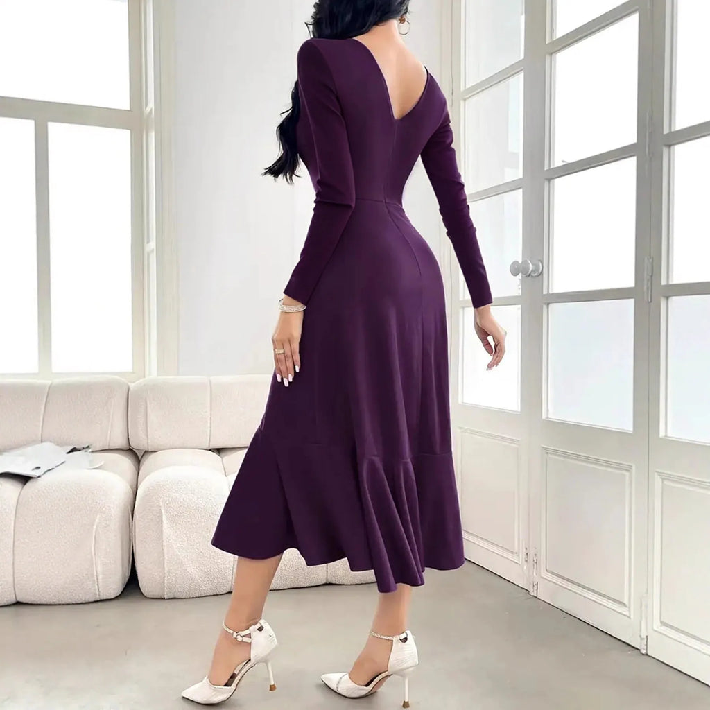 Purple women's long sleeve dress with round neck, mid waist, and ruffle details on a hanger.