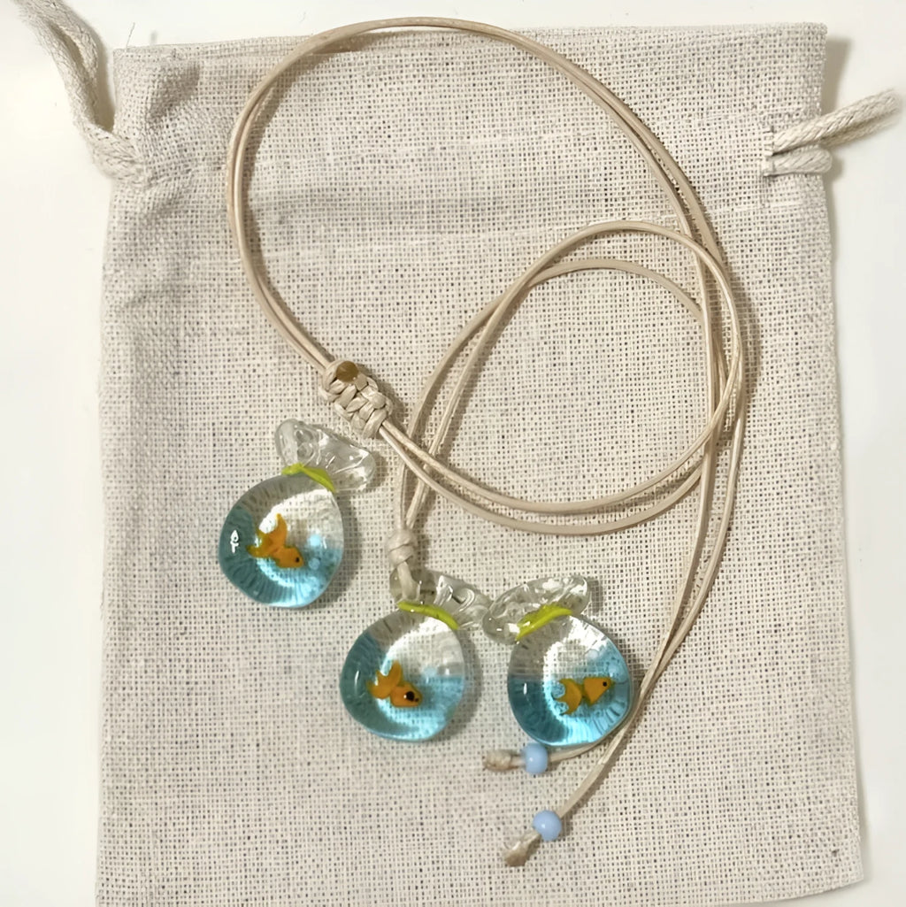 Women's joker design pendant necklace with coloured glaze charm on a cotton and linen clavicle chain.