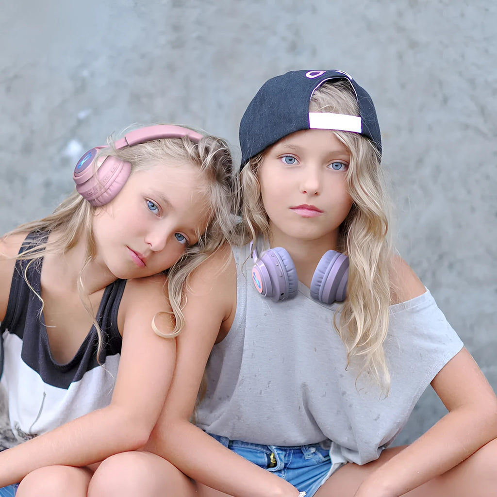 Wireless RGB children's headphones in bunny pink colour with lights on