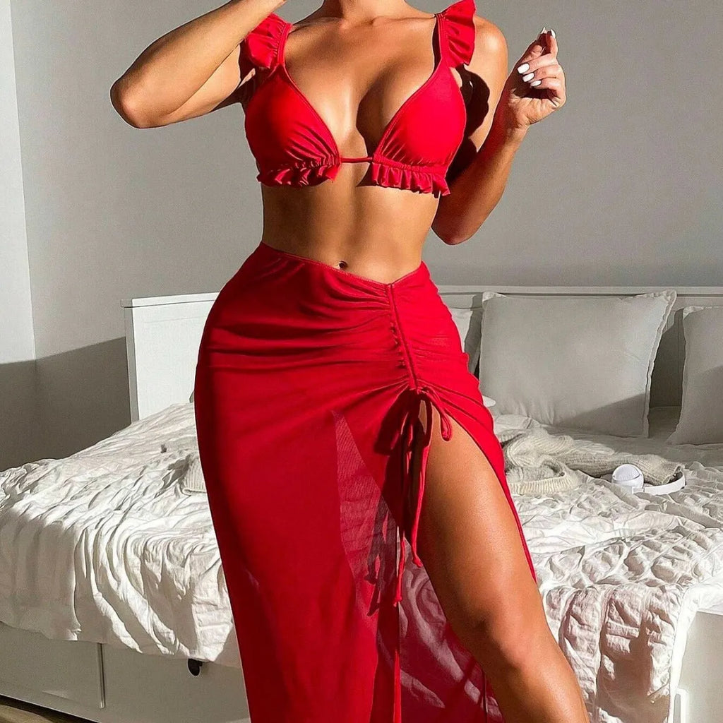 Women's printed three-piece bikini swimsuit set with a separate skirt, shown in one of the available colours.