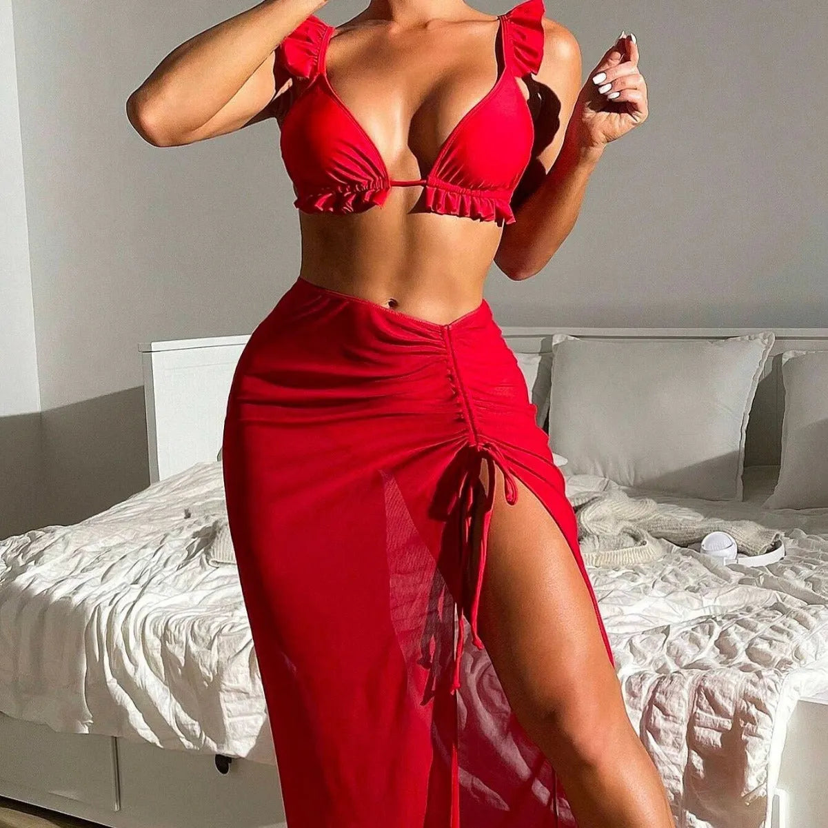 Women's printed three-piece bikini swimsuit set with a separate skirt, shown in one of the available colours.