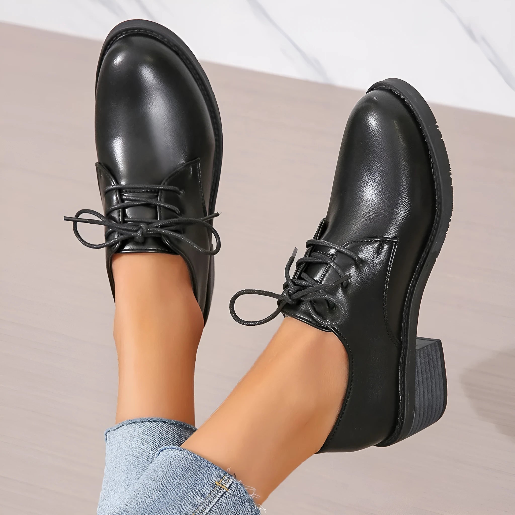 Black women's low-top work shoes with a thick chunky heel and round toe.