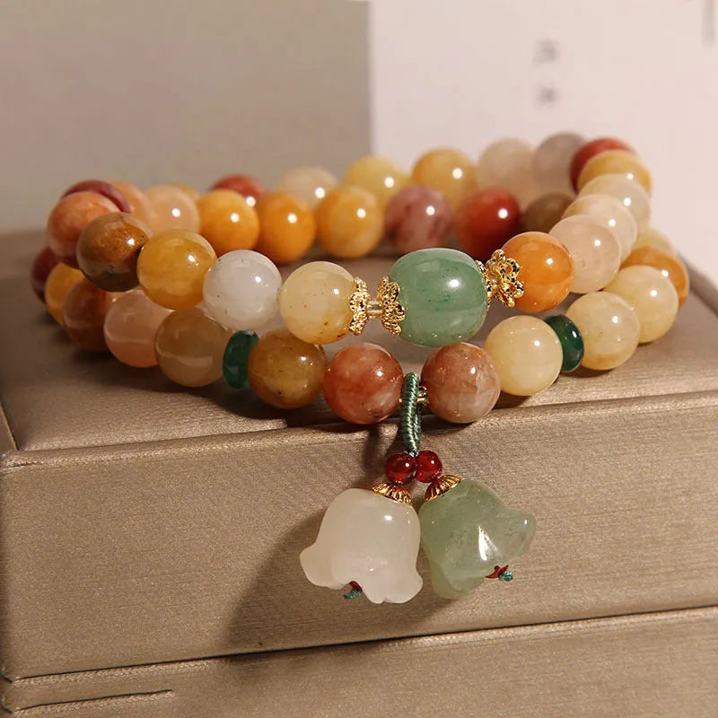 Natural Jinsi Jade multi-layer bracelet for women with orchid pendant on green background