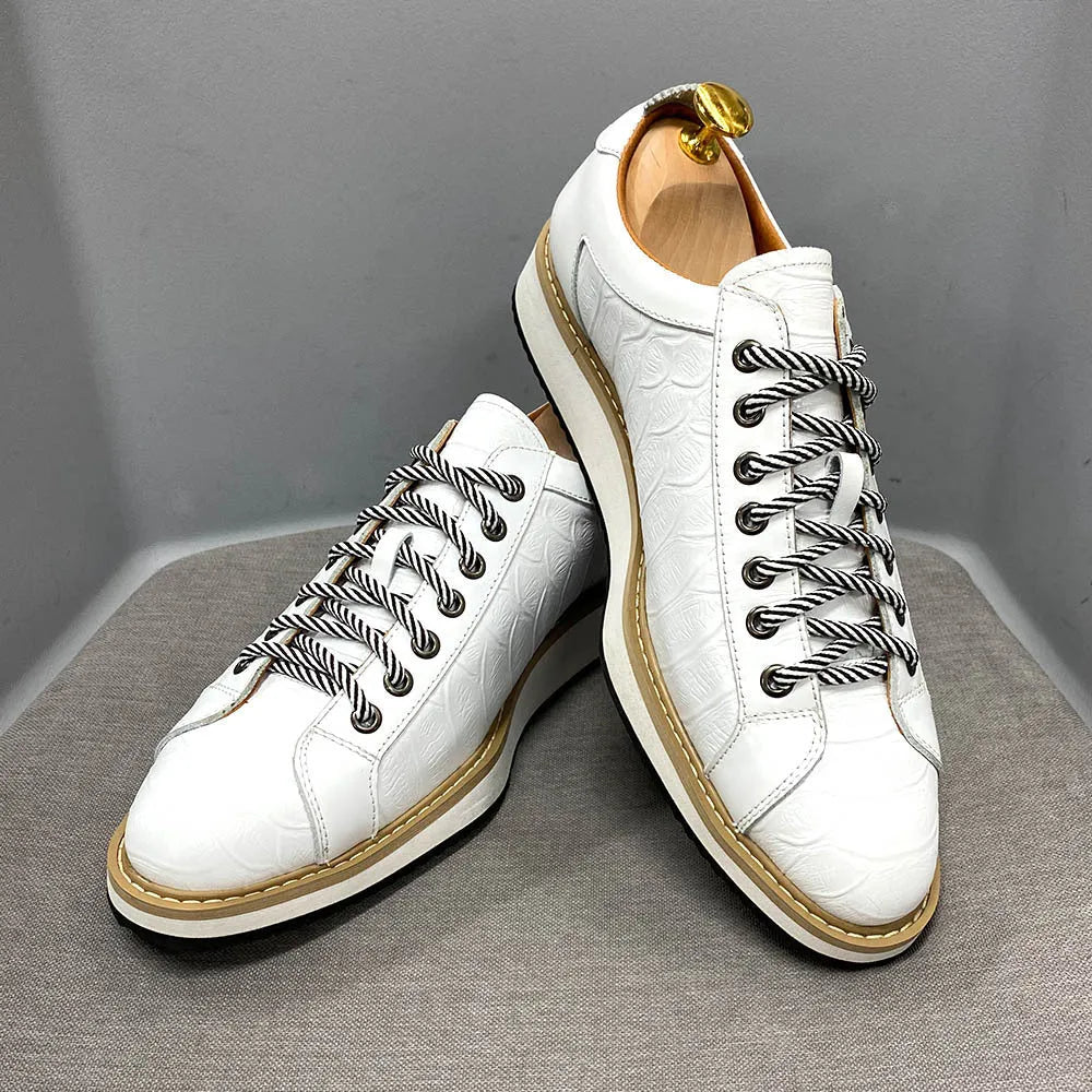 Men's white low-top sneakers with an embossed pattern and front lace-up closure.