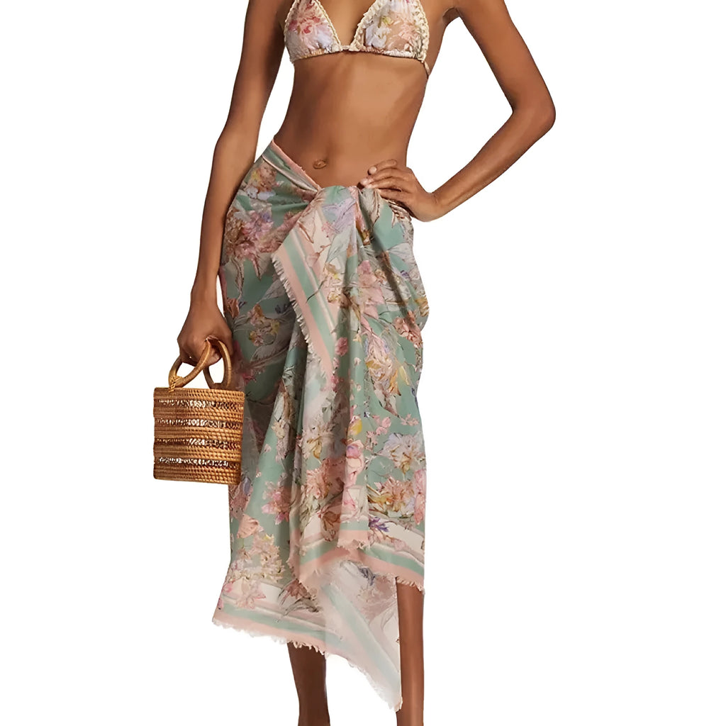 Women's creamy-white floral pattern bikini swimsuit set with top, briefs, and skirt