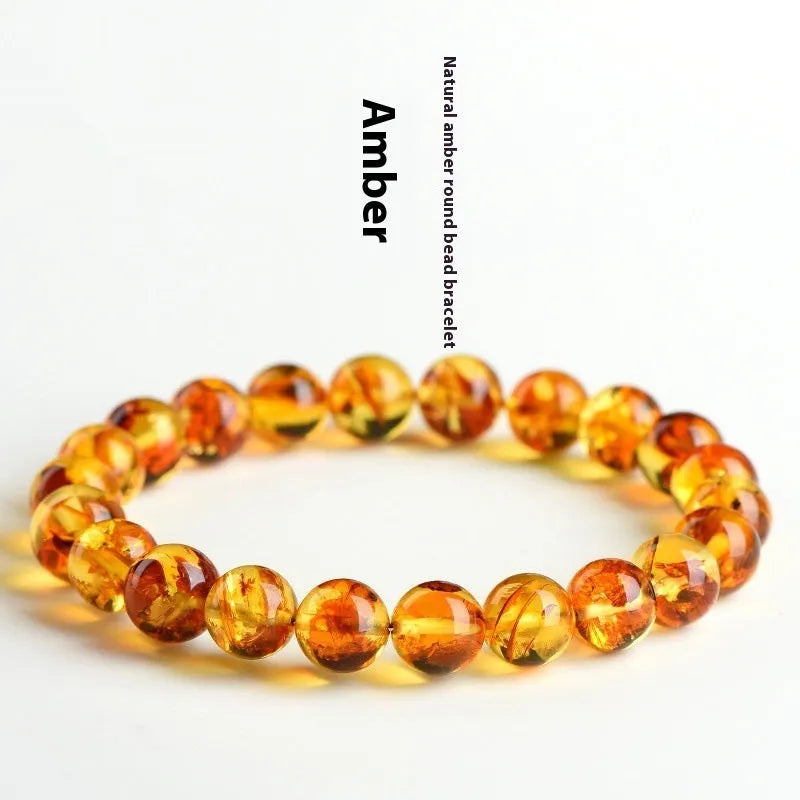 Natural yellow piebald amber bracelet with polished geometric beads on a string