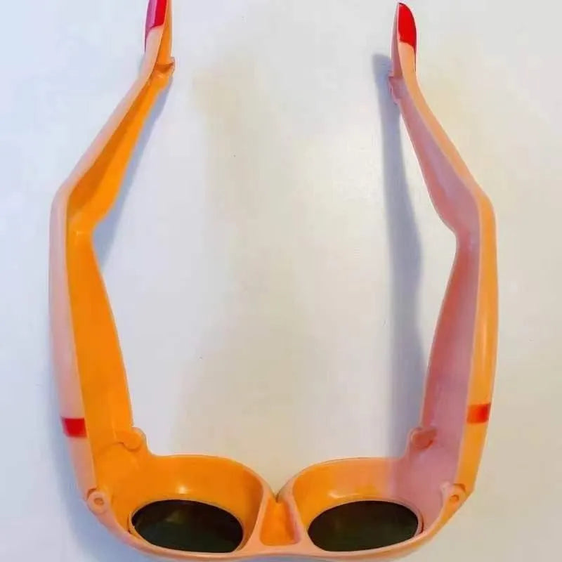 Orange personality sunglasses with leg and hip novelty design on plastic frames