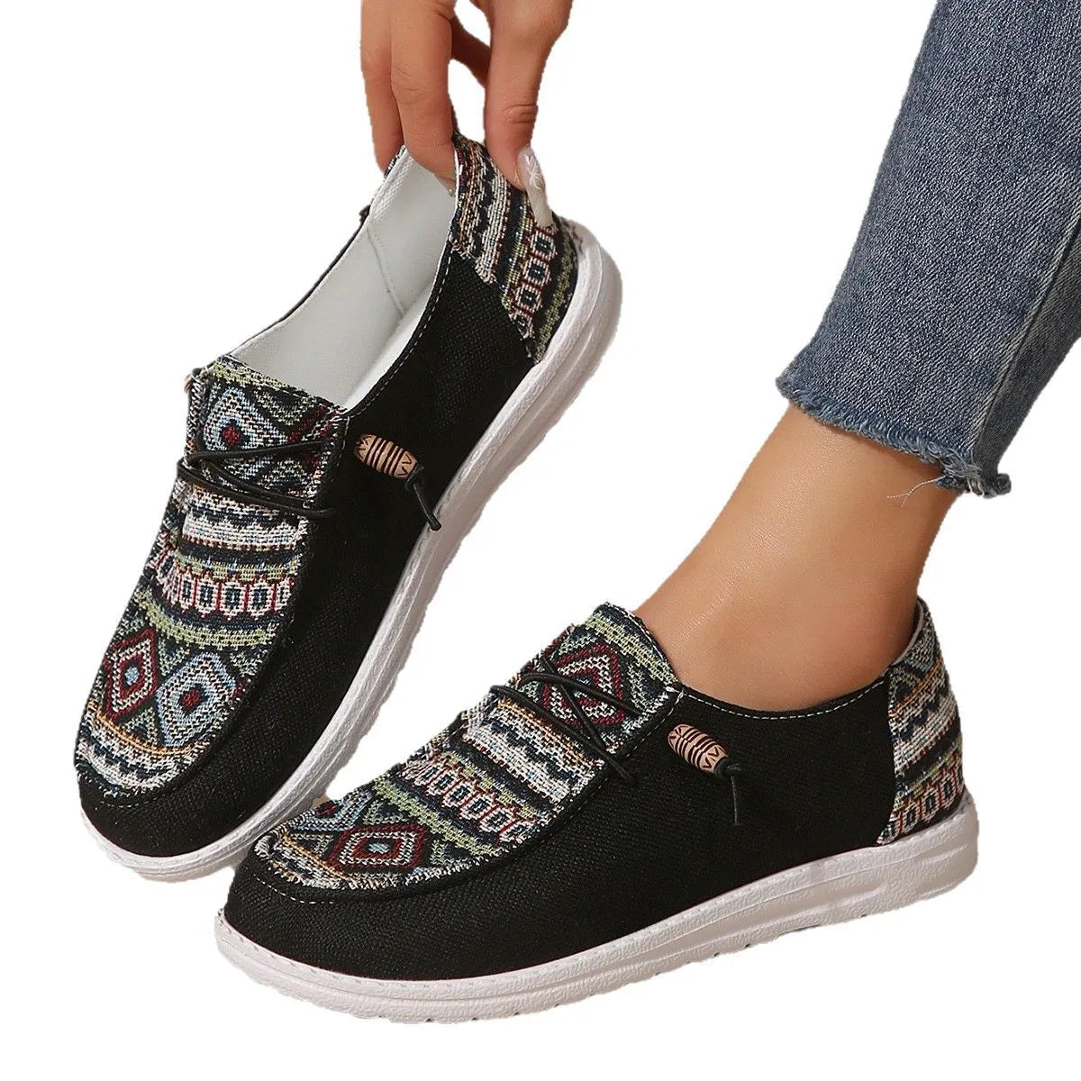 Women's black flat round toe low-top shoes with artificial PU upper and rubber sole.