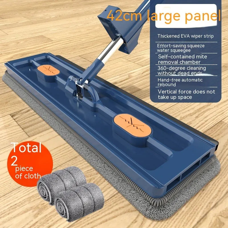 Large flat mop with blue rotating head and long stainless steel handle on a wooden floor