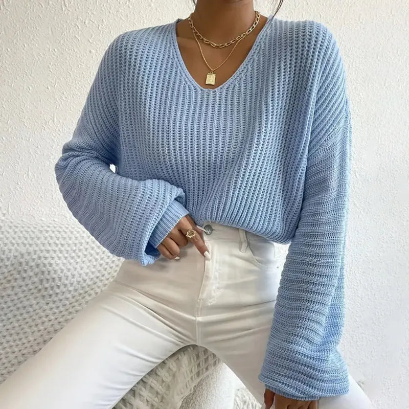 Women's solid colour long sleeve pullover in a loose casual style, shown in one of five available colours.