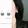 Gold and white geometric drop ear clip earrings with spherical bean design and full diamond flash