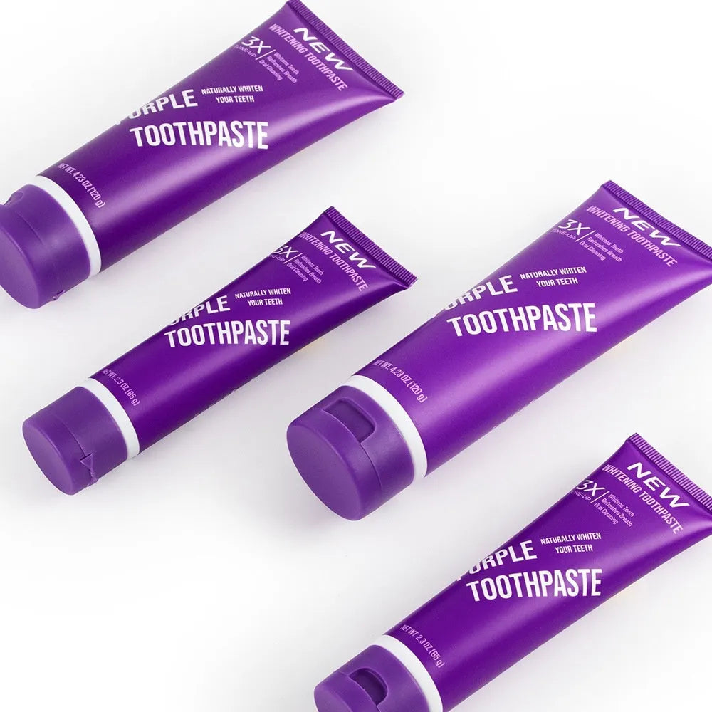 Purple whitening toothpaste tube in 120g and 65g sizes for stain removal and cavity protection