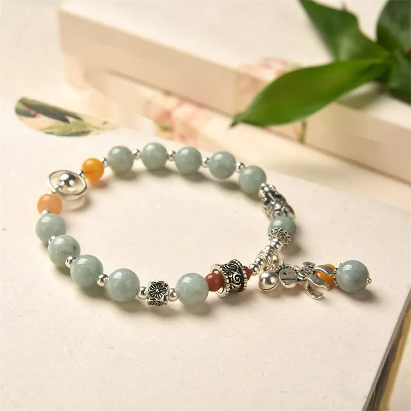 Natural jade vintage bracelet with 8-9mm beads and alloy metal accents on wrist