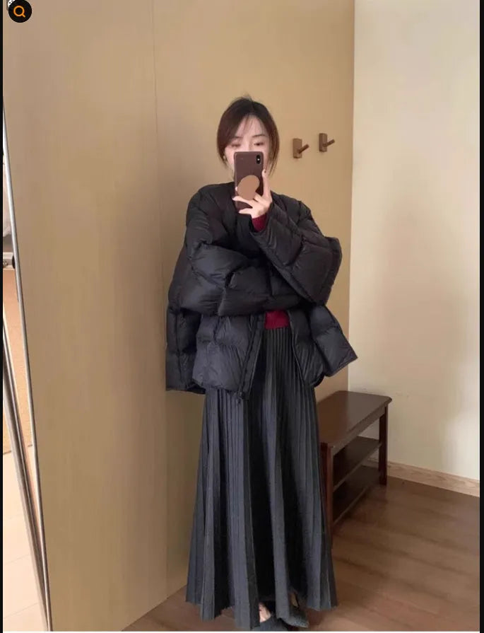 Women's knitted ethnic style dress suit with skirt showing 3D patterns in dark grey colour