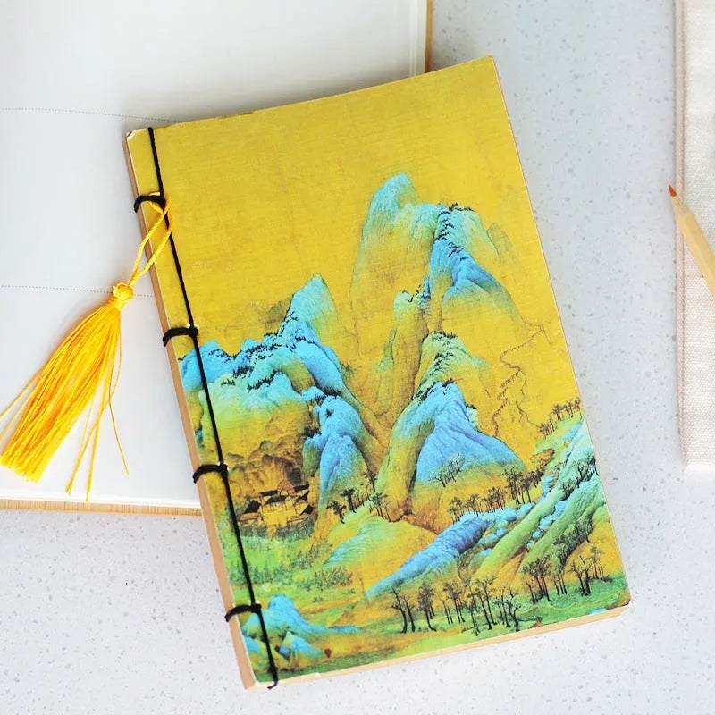 A5 antique wire-bound notebook with retro painting cover, thread binding, and black tassels.