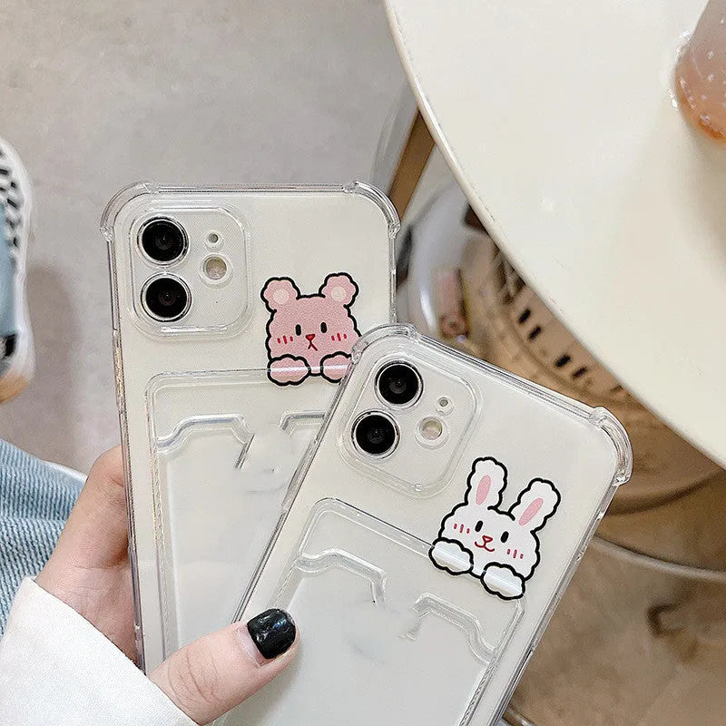 Transparent cartoon-design iPhone case with a card slot on the back, shown in colour options BQ2472 and BQ2473.