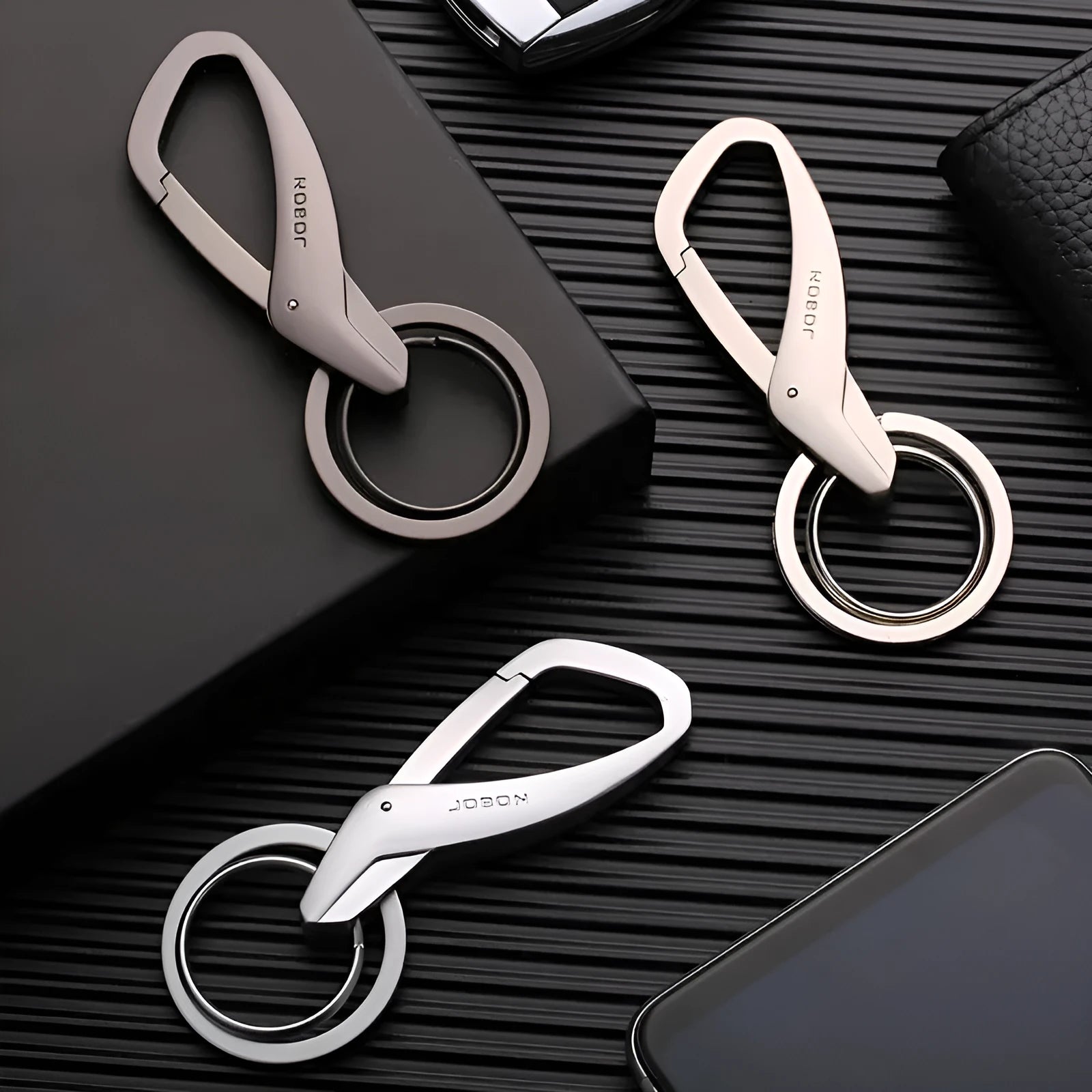 Zinc alloy double ring car key chain in black, chrome, and nickel colour options showing 8.3cm size