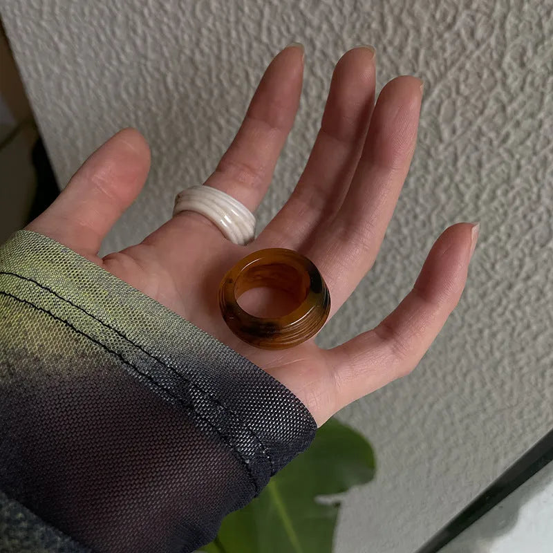 Geometric irregular resin ring in free size, shown in Maillard brown colour.