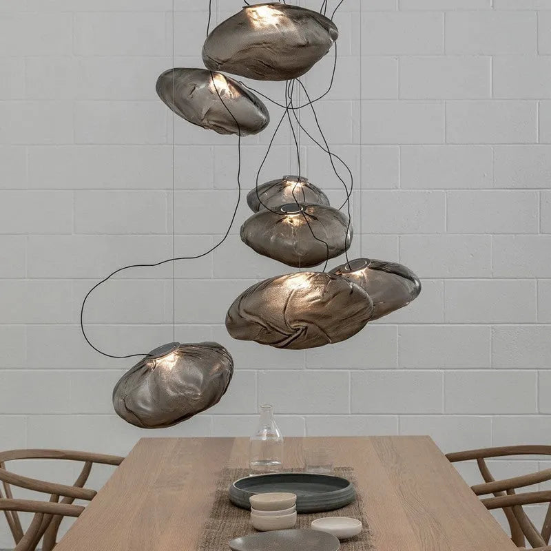 Modern glass chandelier with fabric accents in clear, amber or smoke grey colour options
