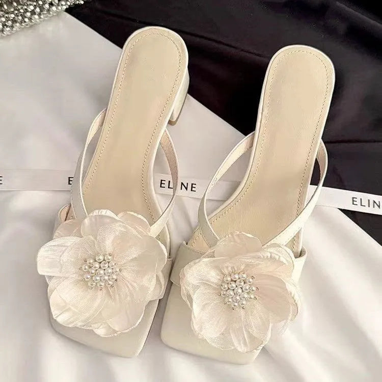 Women's fashion sandals with a chunky heel, square toe, and one-strap satin upper in cream-white colour.