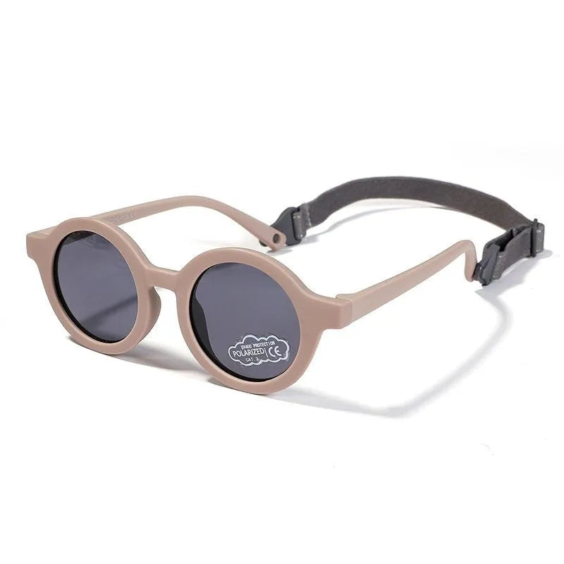 Soft silicone round-frame sunglasses for babies and toddlers aged 0-3 years with polarised UV400 lenses.