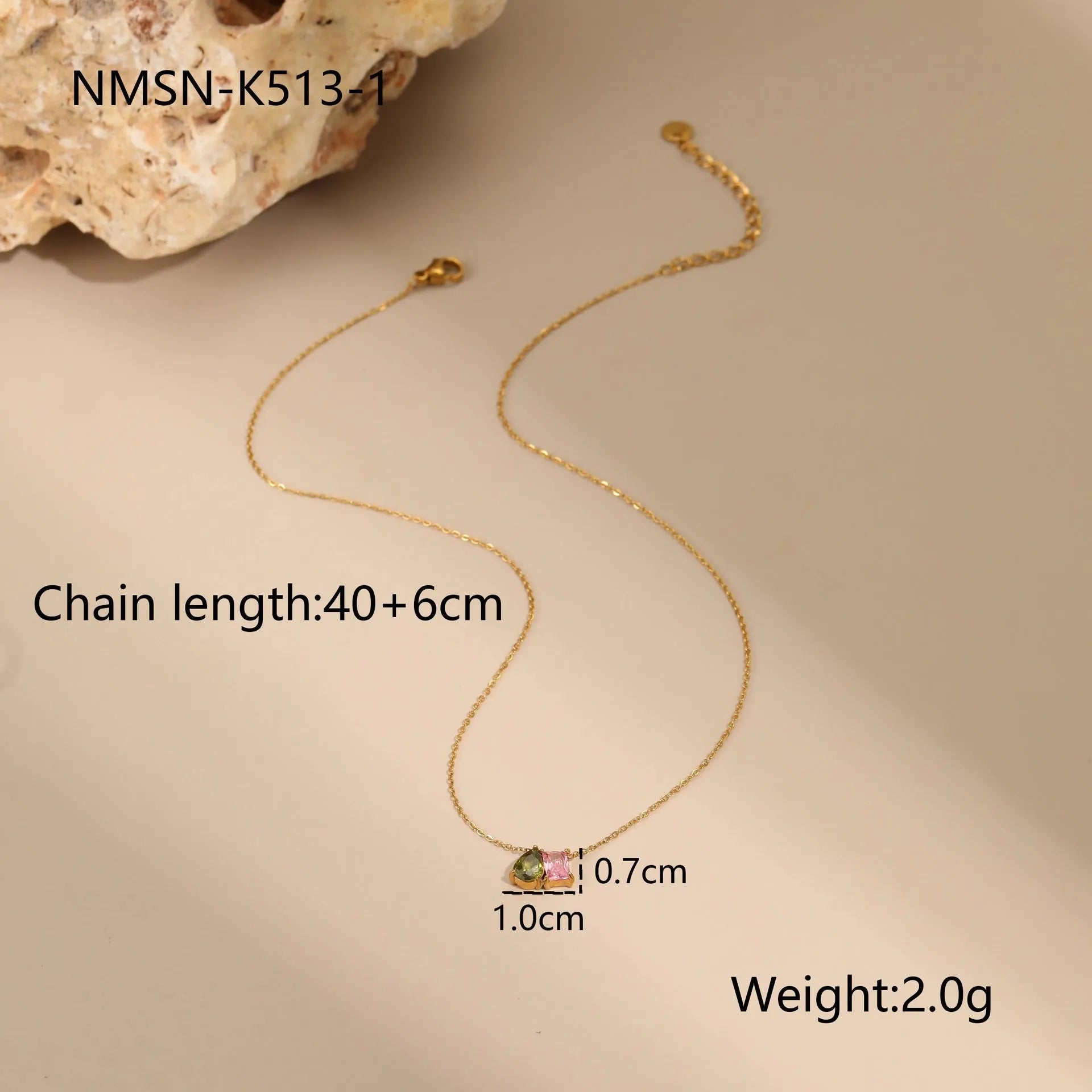 Geometric gold-plated zircon jewellery set showing necklace, ring and earrings with adjustable chain