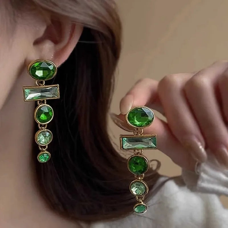 Green gradient geometric drop earrings with zircon inlays and a tassel design.