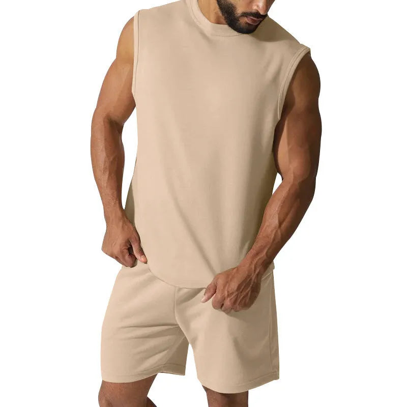 Men's sleeveless sports suit consisting of thin cotton blend top and matching shorts in solid colour