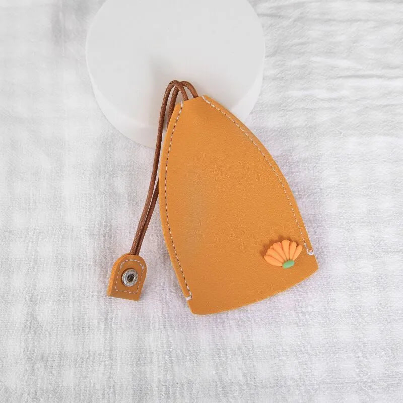Colourful cartoon pull-out key case made from PU leather showing design options