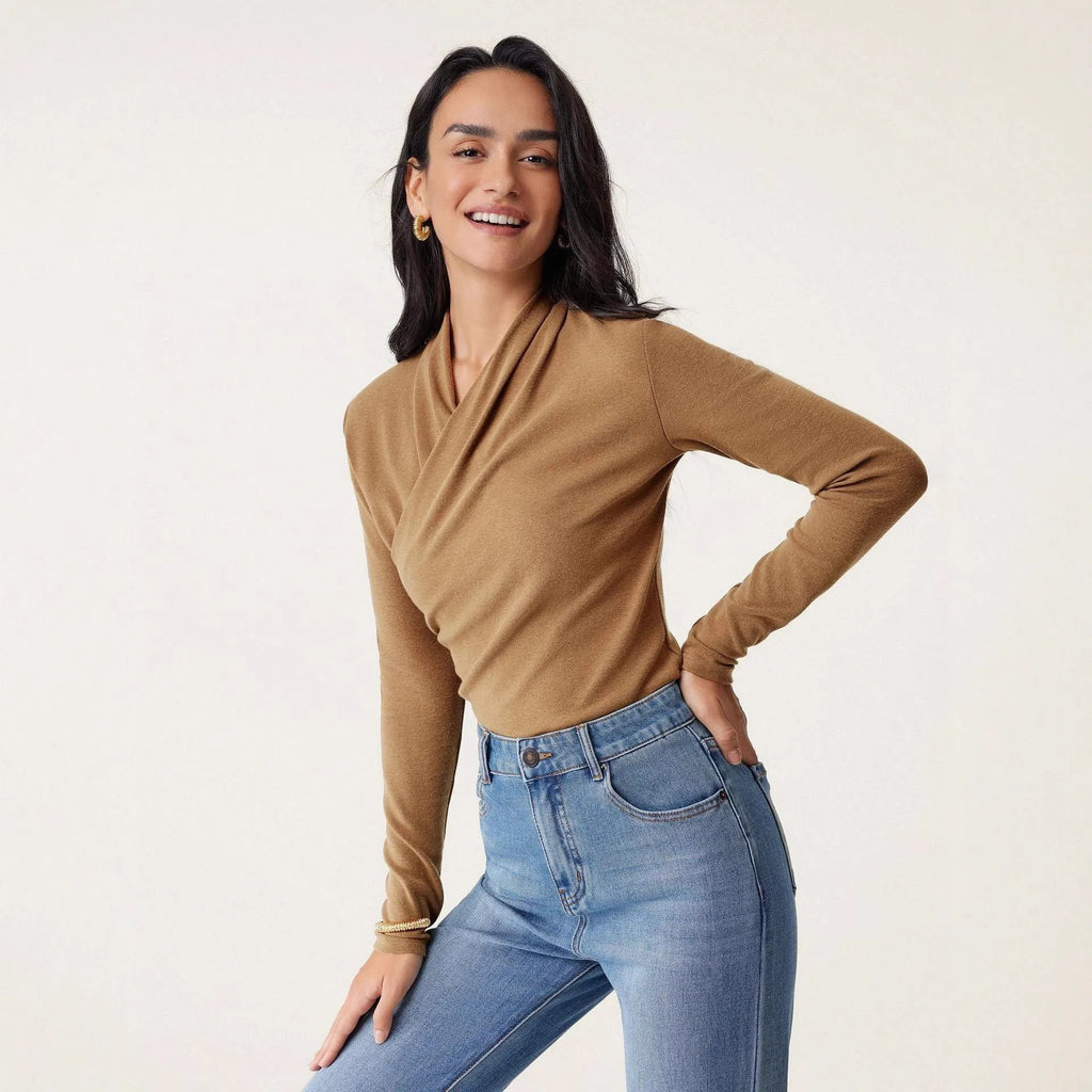 Camel-coloured slim-fit women's pullover sweater on a hanger.