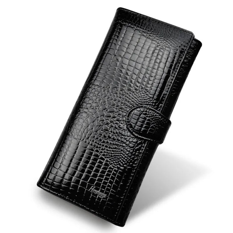 Women's leather coin purse with crocodile pattern embossing in red colour showing interior pigskin lining