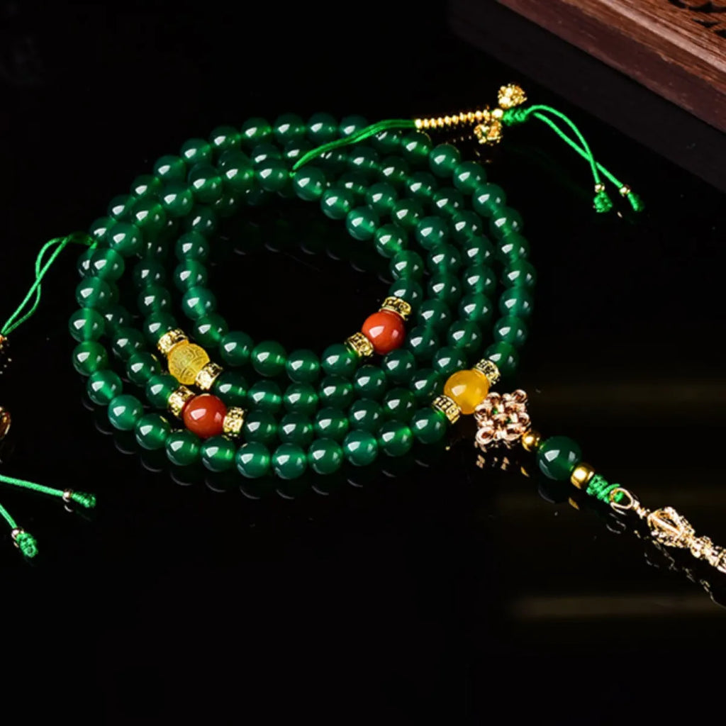 Handcrafted multi-circle green agate bracelet with natural stone beads on a wrist.
