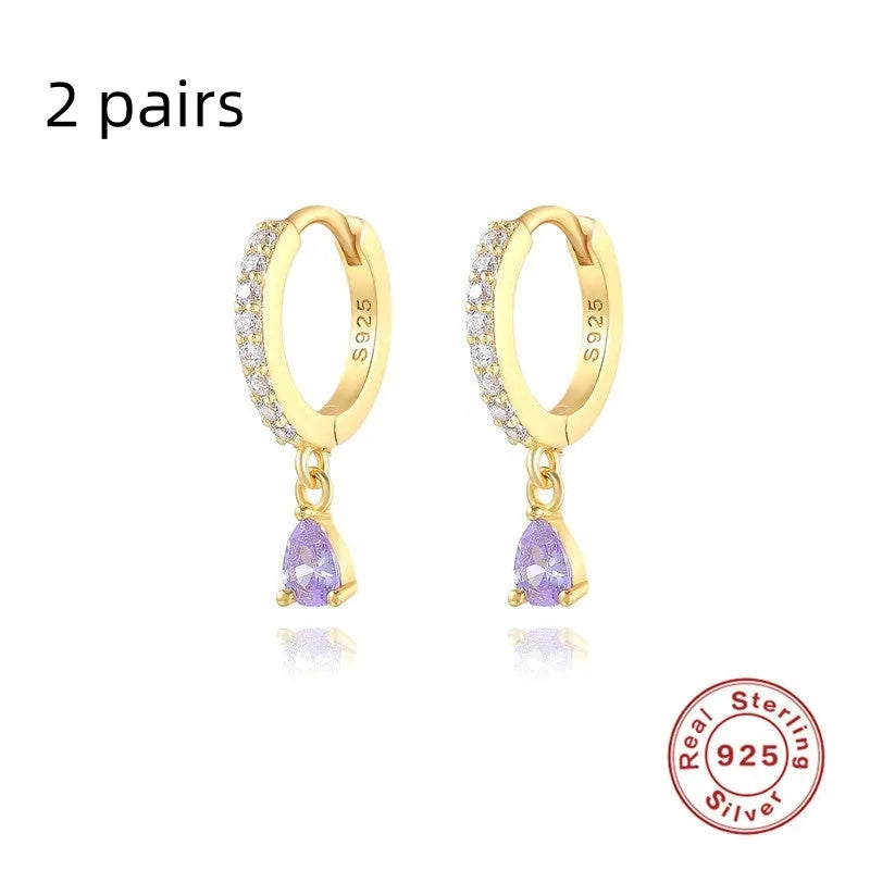 Geometric water drop sterling silver earrings with electroplated finish and sparkling stone detail.