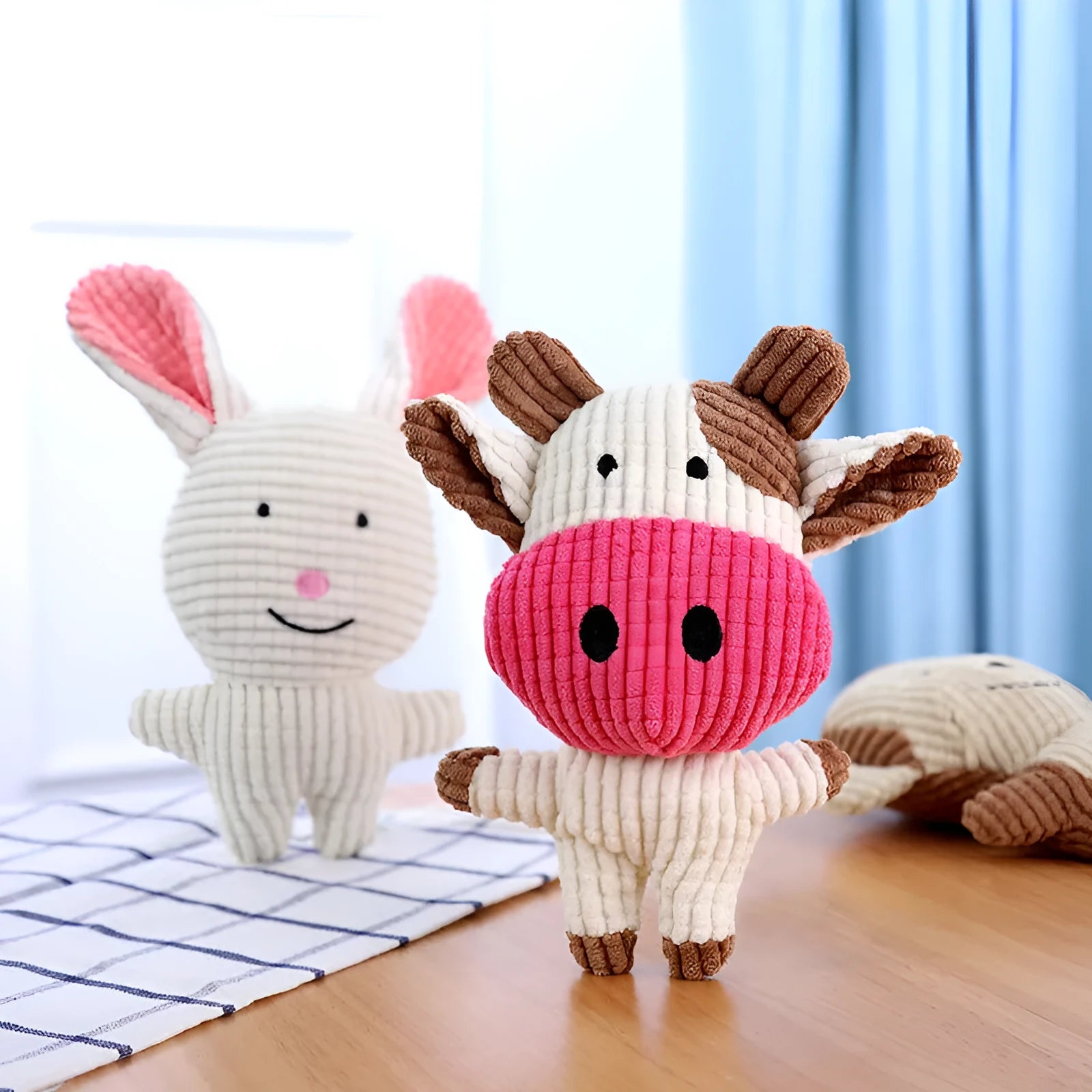 Animal-shaped plush dog chew toy with squeaker, available in multiple colours.