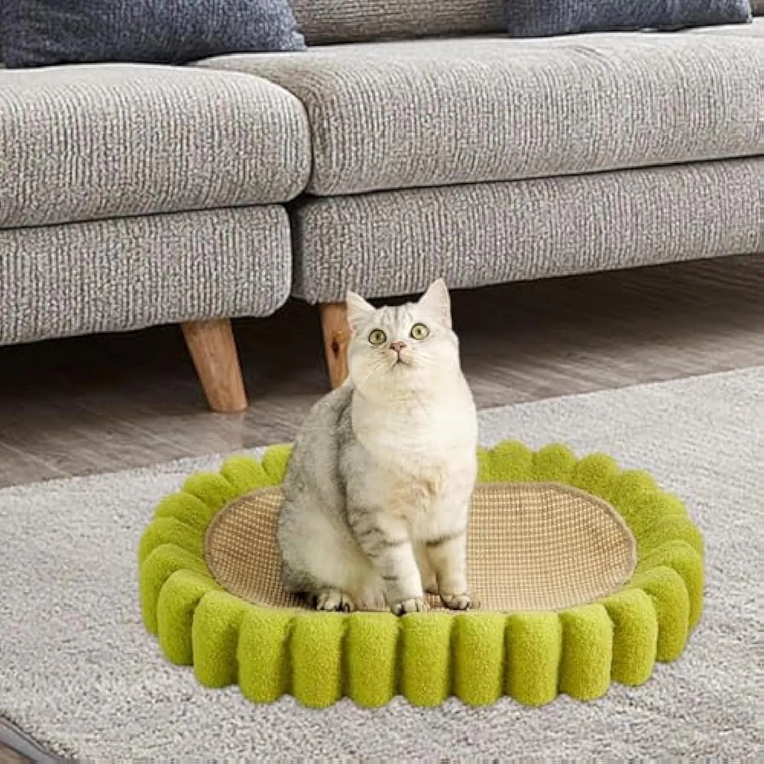 Green oval sisal cat scratch pad bowl measuring 650mm functioning as cat scratcher and bed