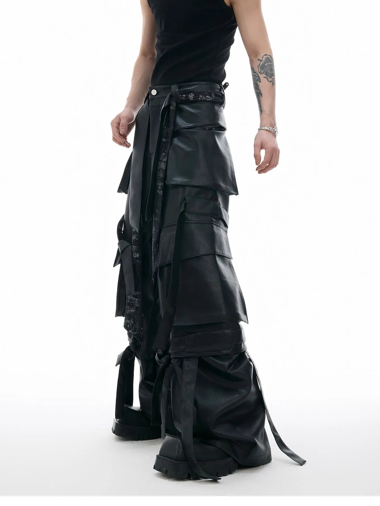 Men's black loose-fit leather trousers with quilted stitching and multiple pockets