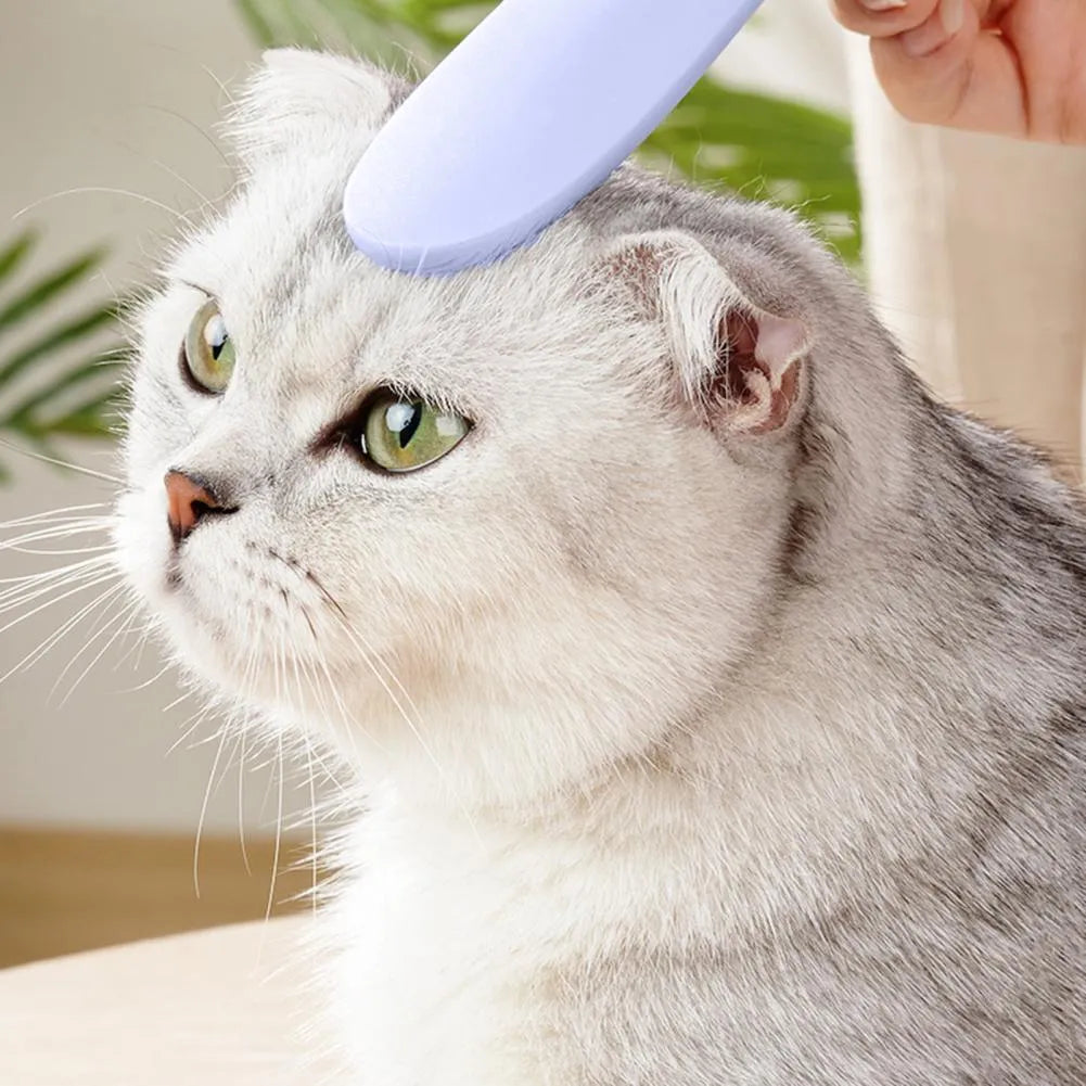 Grey and pink cat grooming combs with tongue massager design and dual ends