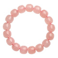 Natural pink crystal bead bracelet with geometric barrel-shaped design measuring 8-10mm per bead