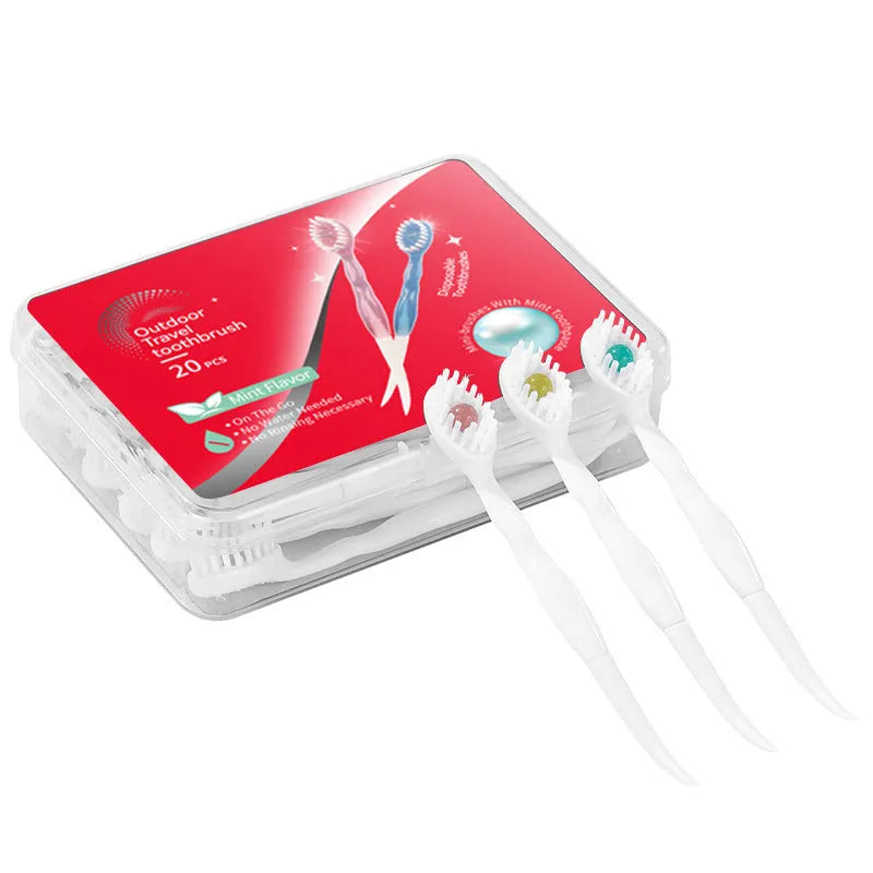 Box containing 20 small white disposable bead toothbrushes with compact rounded heads for travel.
