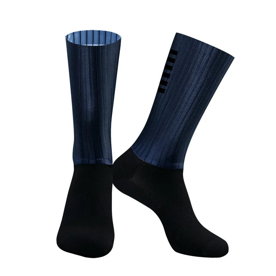 Athletic sports socks for cycling and running in six colour options including orange, black, and purple.