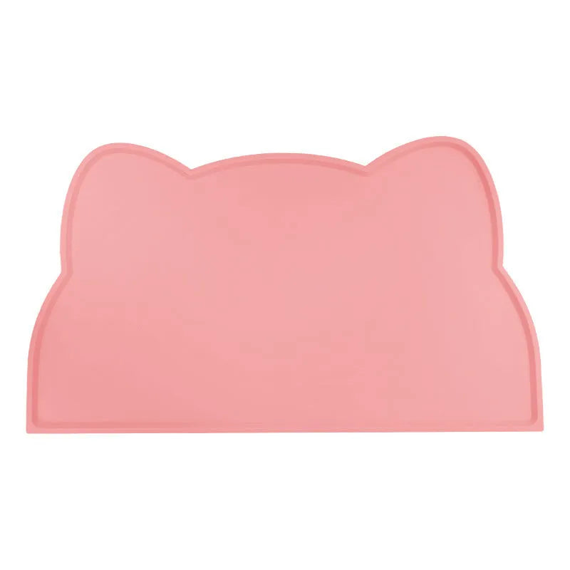 Blue silicone waterproof pet feeding mat for dog or cat food bowls on a wooden floor.