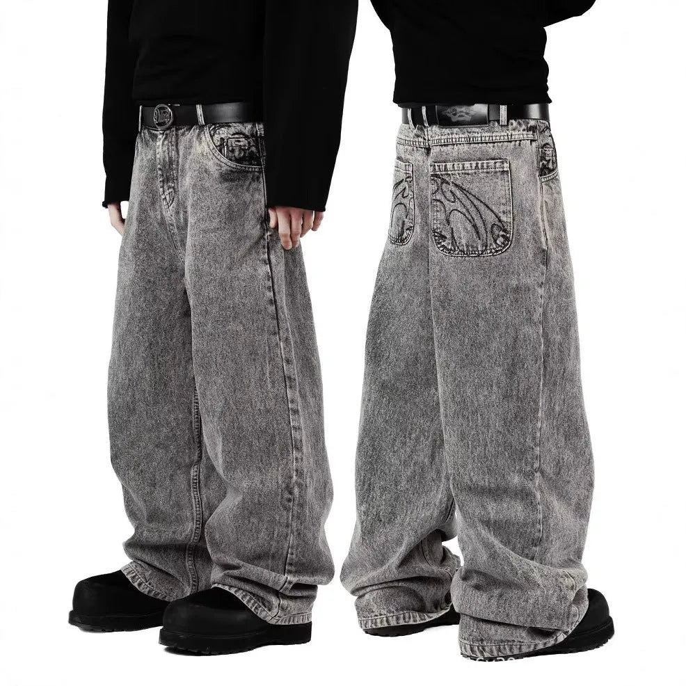 Grey loose straight-leg denim trousers for men and women on a neutral background