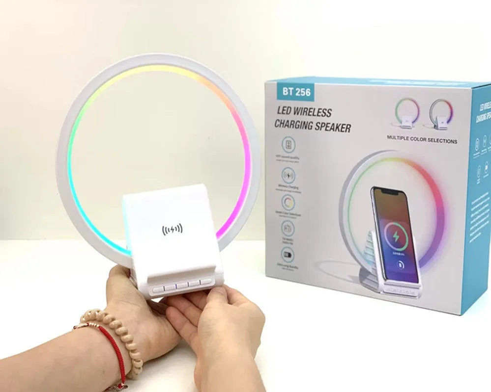 White Bluetooth speaker with ambient lighting and wireless charging pad measuring 225x200x10mm