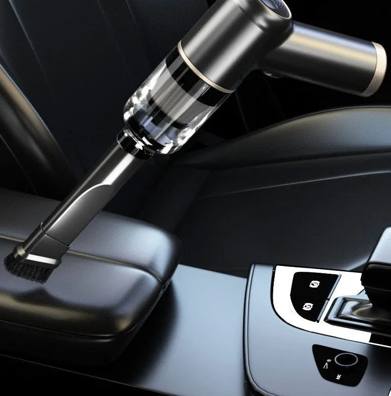 Black wireless car vacuum cleaner and inflator with multiple nozzle attachments