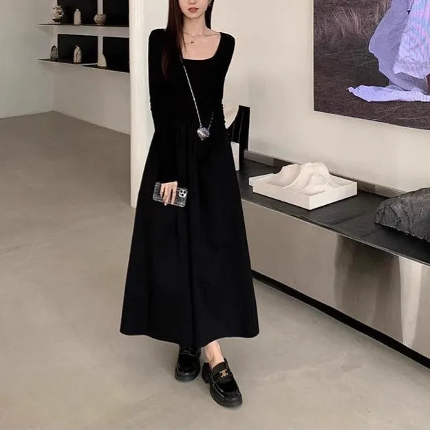 Women's black square collar knitted dress with long sleeves and an A-line skirt.