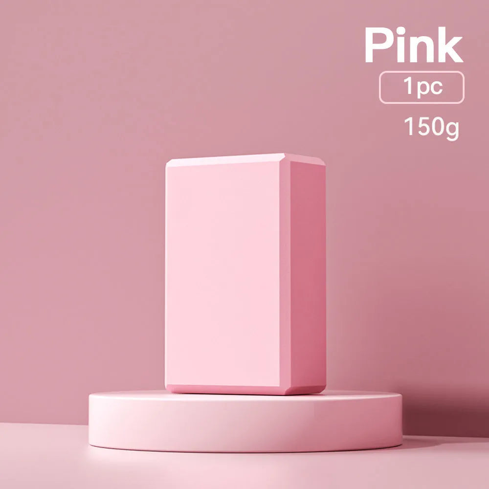 Solid colour EVA foam yoga block with ridged surface, measuring 23cm long